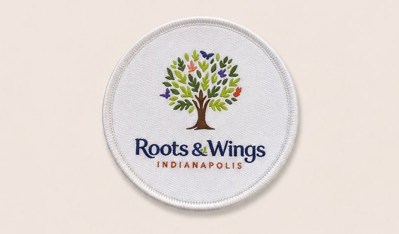 Woven Roots & Wings patch with merrowed border